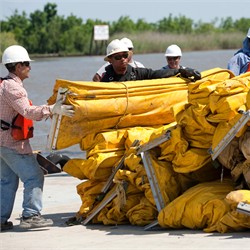 Workers Prep Booms to Protect Shoreline
